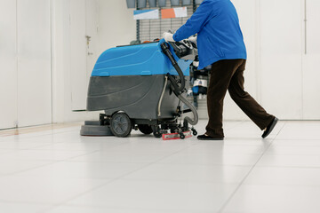 cleaning floor with machine	