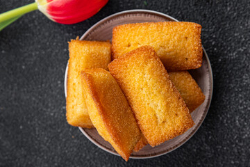 cake financier almond taste sweet dessert biscuit cake healthy meal food snack on the table copy space food background rustic top view