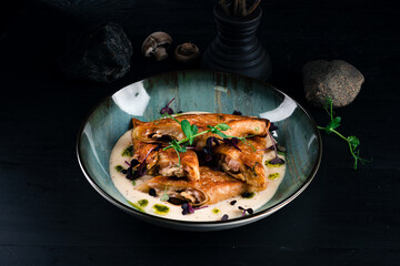 Fried thin pancakes with ham, cheese, mushrooms and sauce.