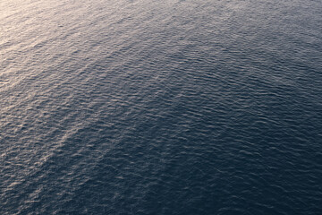 blue ocean with the light of the sunset, sea surface texture