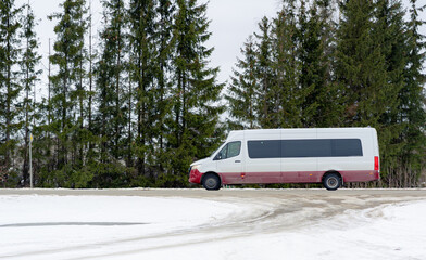 Fototapeta premium An intercity passenger express bus is driving along the highway