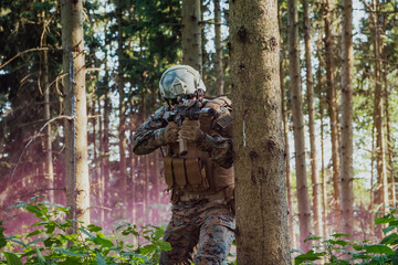 A modern warfare soldier on war duty in dense and dangerous forest areas. Dangerous military rescue operations