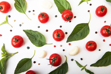 Tomato cherry, basil, spices, pepper. Fresh organic tomatoes, isolated on white.
