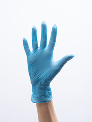 Isolated doctor's hand in blue medical gloves, open palm. Demonstrating of durable nitrile gloves on white background. 
