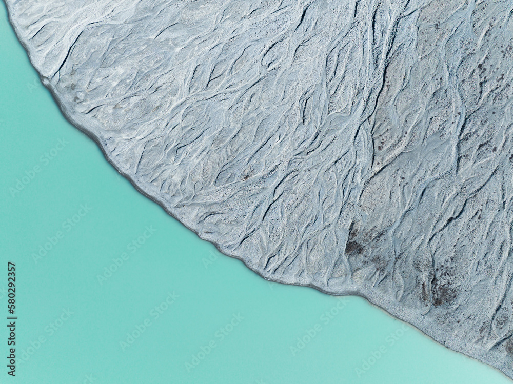 Wall mural drone view of the azure lake in the glacier valley. view of the moraines. landscape from the air. ri