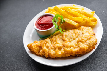 fish and chips deep fried fast food french fries takeaway meal food snack on the table copy space food background rustic top view