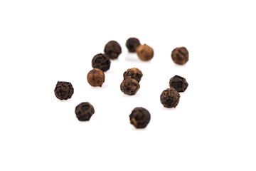 Black pepper seeds on white