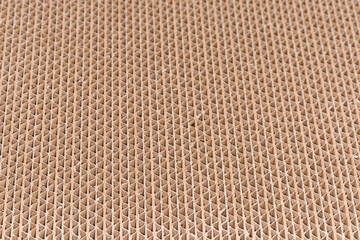 Cross section of multilayer unbleached corrugated cardboard, selective focus