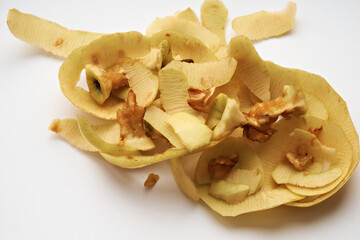 Peels and cores of apples on a white background. Close-up