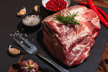Raw pork loin with spices and herbs. Fresh meat cut, ingredient for cooking protein food