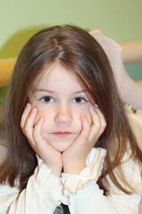 Portrait of a cute girl. Cute baby looks at the camera.