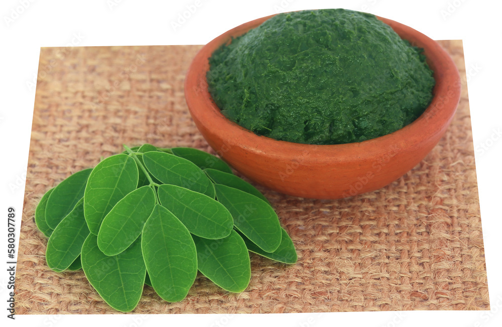 Sticker edible moringa leaves with ground paste