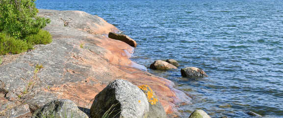 Smooth rock and blue sea in the archipelago in Finland 
