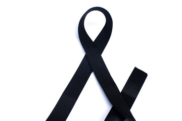 the unraveling black ribbon represents mourning. mourning ribbons on a white background