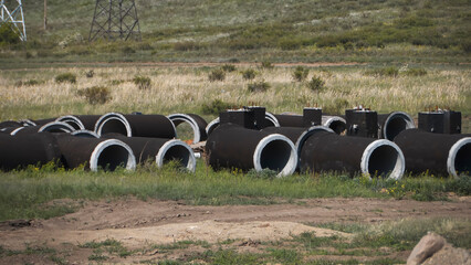 Concrete sewer well. Installing underground storm systems of water main and sanitary sewer.
