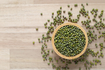 Top view of green beans in a bowl on wooder background, Healthy eating concept