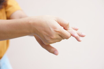 Asian woman having hand numbness