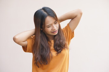 Fototapeta premium Asian woman suffering from neck pain from work
