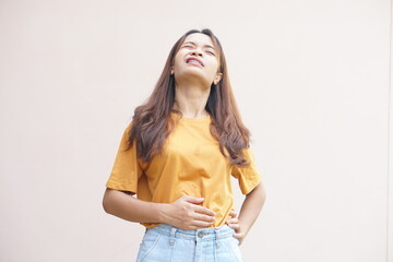 Asian woman having lower back pain from work