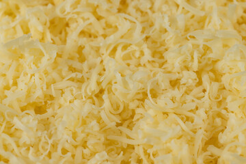 Hard cheese with holes grated into thin small slices