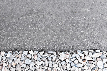 Part of road with asphalt and gravel