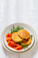 pancakes with sliced cold smoked salmon, top view