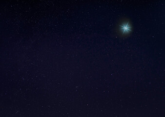 Fototapeta na wymiar Bright blue star in the night sky