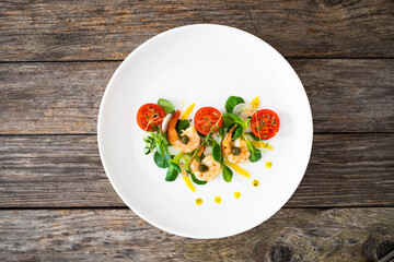Prawn salad on wooden table
