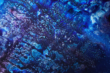 Luxury abstract background, liquid art. Blue alcohol ink with golden paint streaks, water surface, marble texture