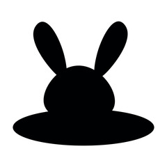Silhouette of a rabbit in a hole