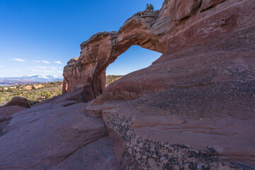 hiking the broken arch trail in arches national park, utah, usa