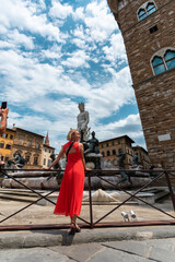Young female traveler near famous Neptun fountain in Florence. © LALSSTOCK