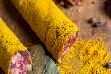Sliced veal salami with turmeric