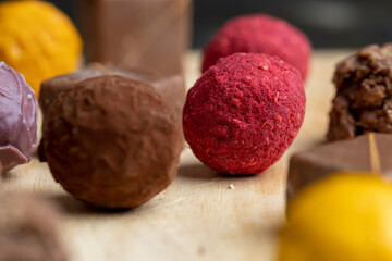 Chocolate sweet candy in the shape of a ball on the table