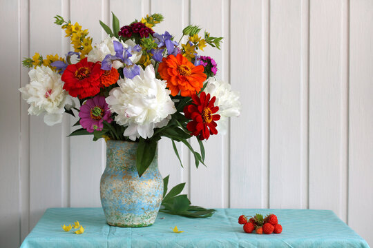 cottage core. a bouquet of garden flowers on a table.