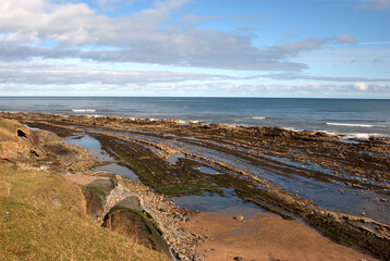 rocks on Cocklawburn beach in Northumberland in winters sun