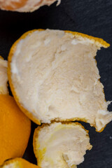 Peel of ripe peeled tangerines scattered on the table