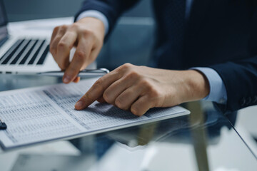 Image of businessman hands taking business notes at office.