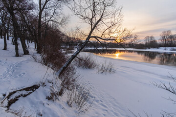 winter landscape with river and sun