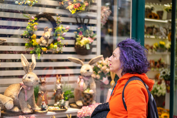 Adult Woman Contemplating The Window Of A Flower Shop