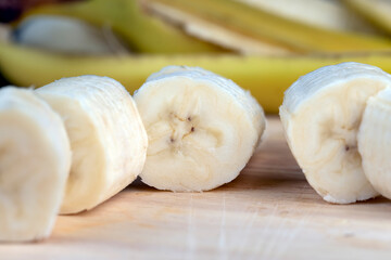a ripe sweet banana cut into pieces lies on the table