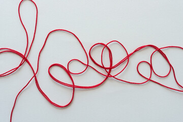 red yarn on paper