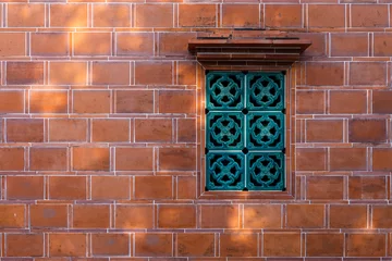  Chinese style window over the red brick wall building © leungchopan