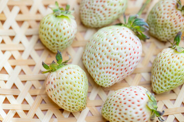 Delicate white strawberries in a basket