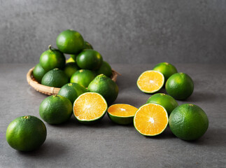 Fresh tangerines on gray background	