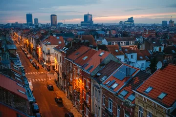 Gordijnen Brussels rooftops in romantic evening lights in Belgium capital © Kaspars
