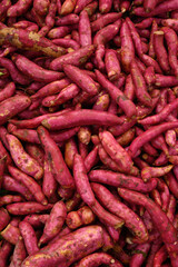 Fresh Sweet potato on market as background. Top view. Organic texture. Local food and vegetables. Agriculture.
