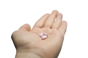 Medicines lie on a woman's palm. The concept of medicine, treatment.
