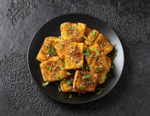 Baked accordion potato with parsley, garlic and herbs. Vegan healthy food