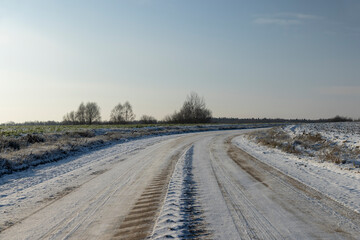 A road covered with snow and ice for cars